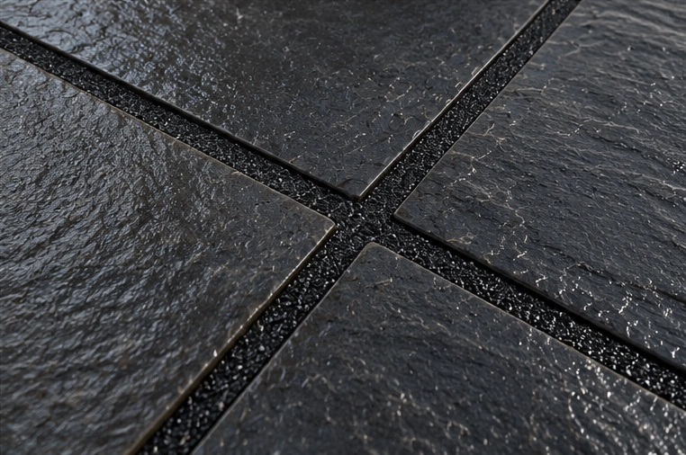 Black patio jointing with dark porcelain paving