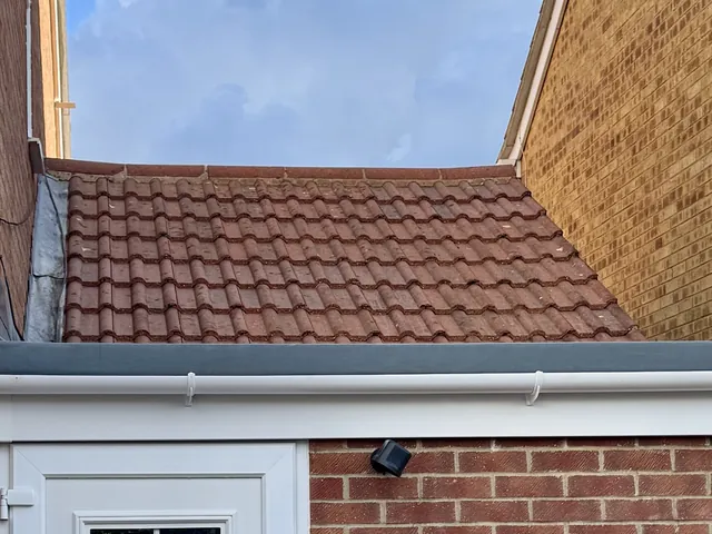 The same extension roof after cleaning, with clean, even tiles